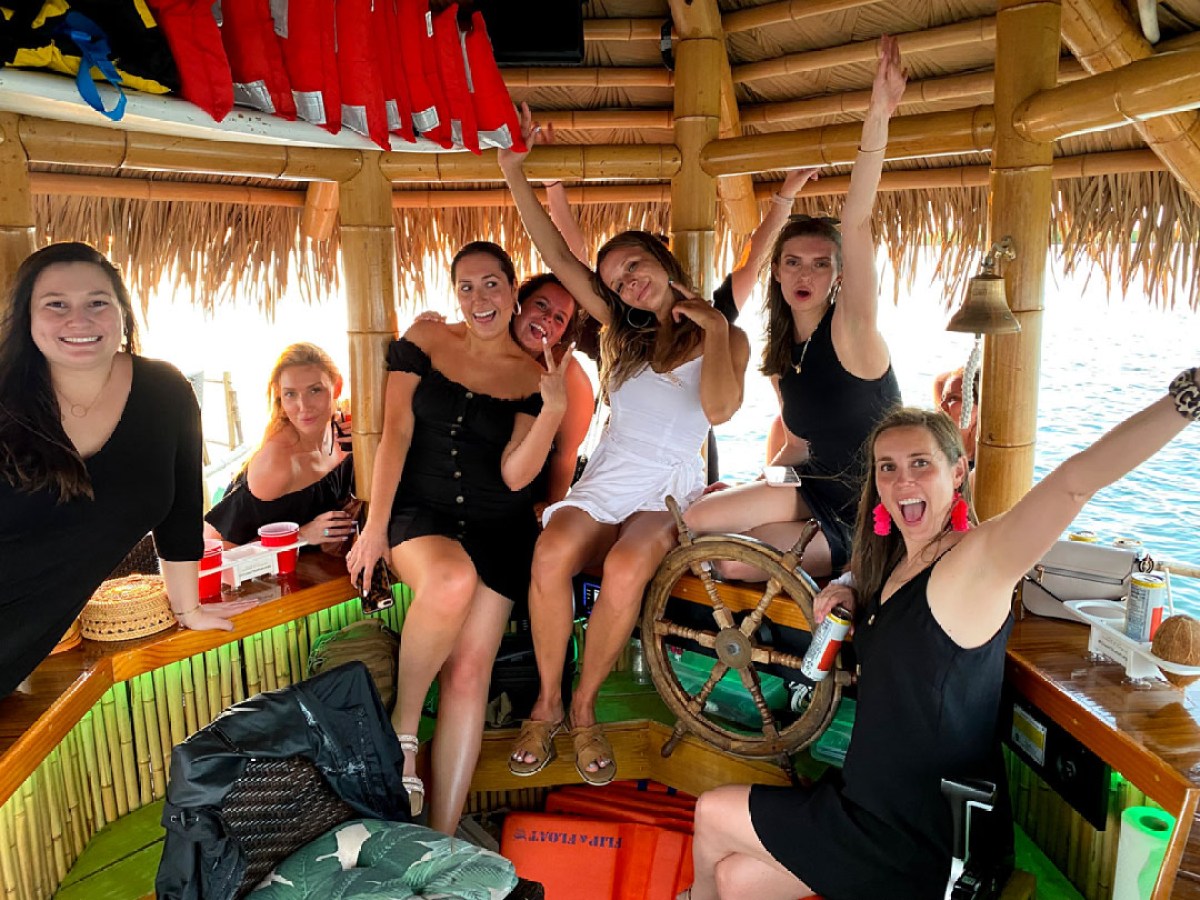 a group of people sitting on a bar counter